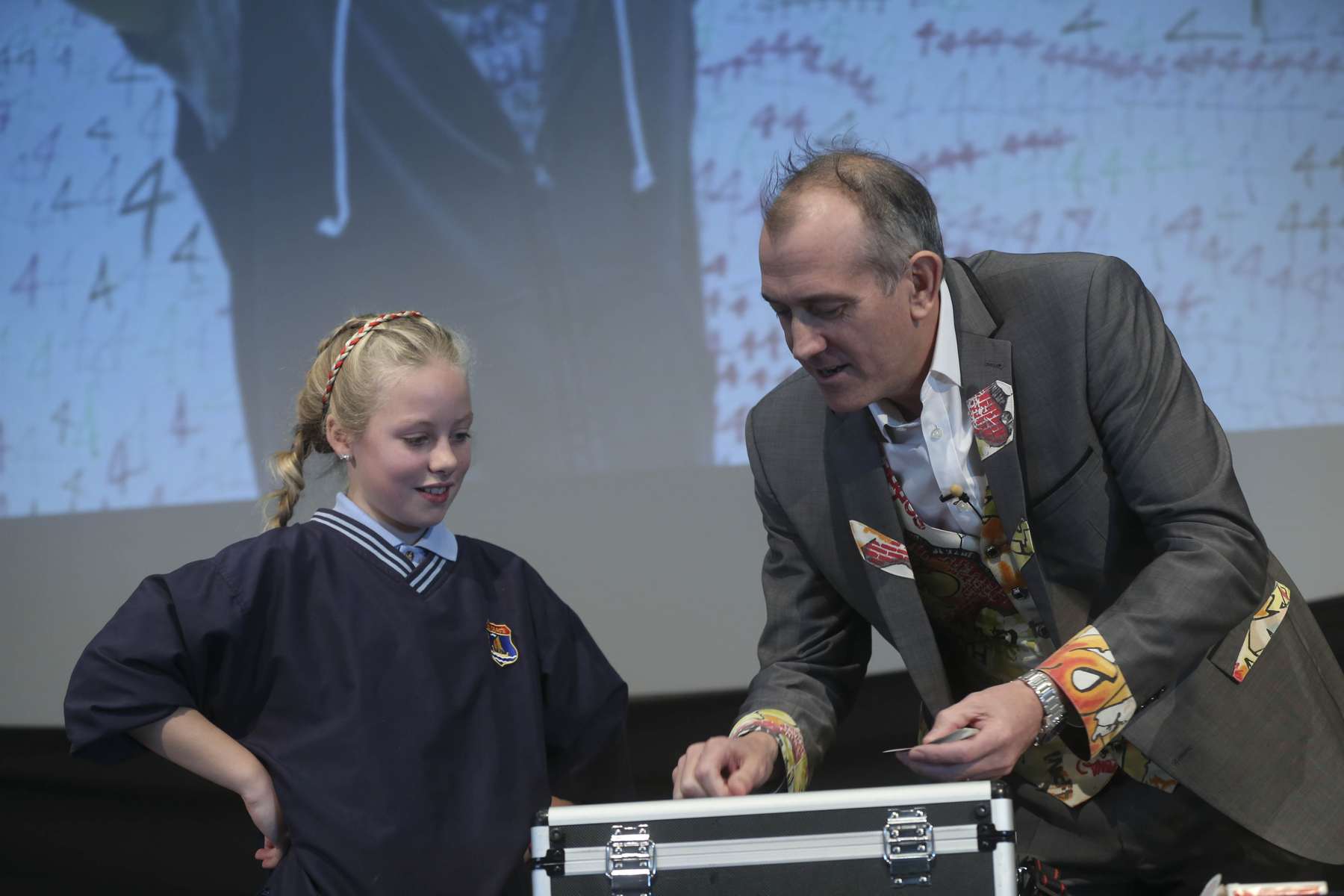 Counting Cards Maths Trick A Pupil watch Dr Ken count out their selected number of cards onto a briefcase.