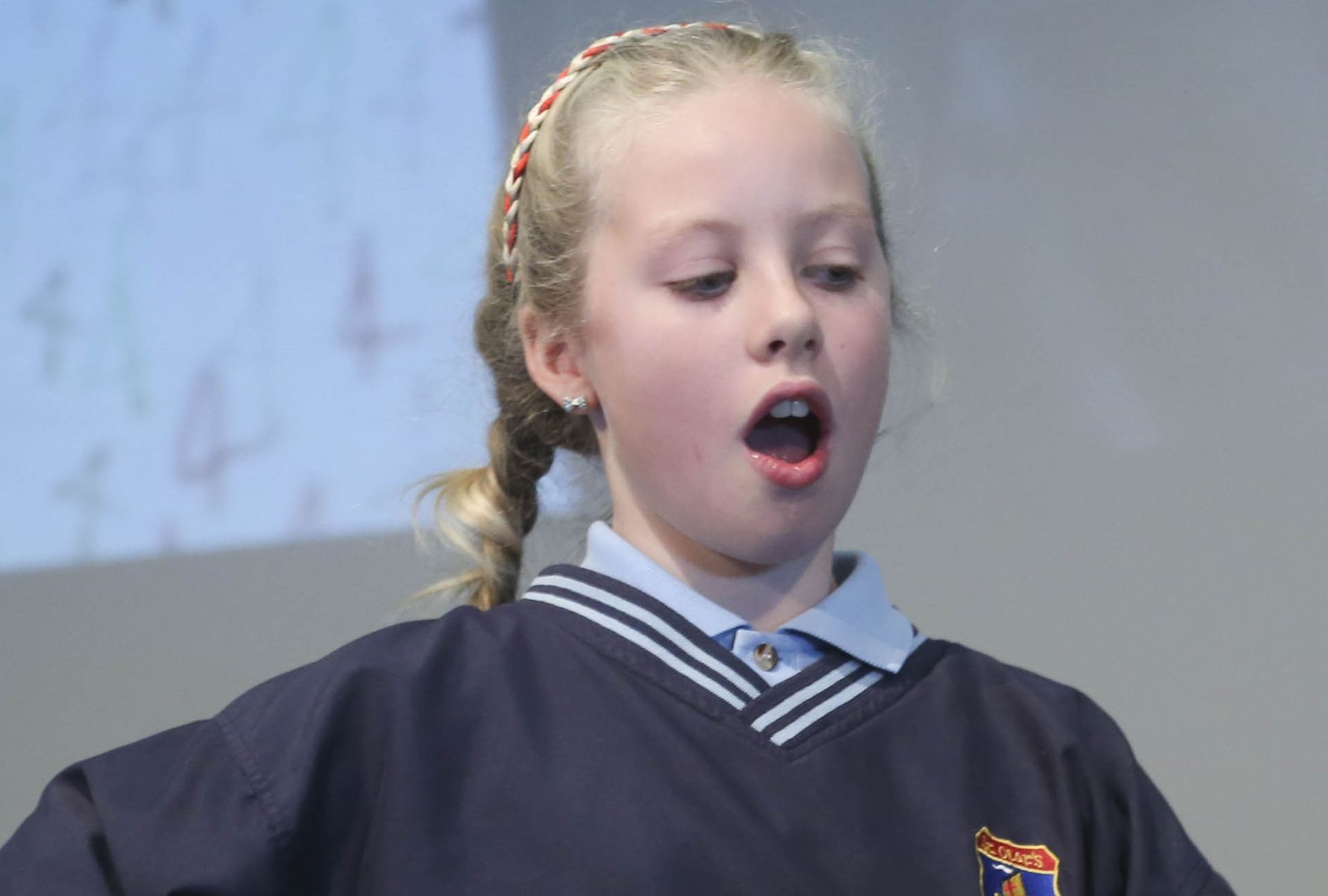 Pupil Reactions to Maths Young pupil reacts in surprise to a maths card trick.